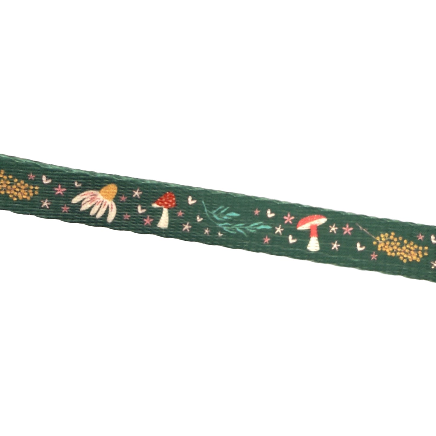 Decorative ribbon with mushroom and flower pattern on a white background